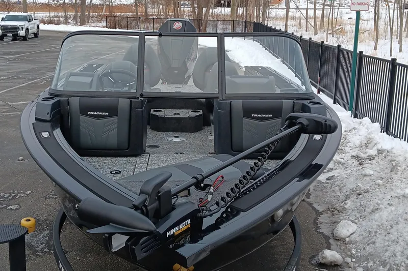 Slide: The Image of 2026 Tracker Targa V-19 Combo boat with Minn Kota motor in snowy parking lot. - 3