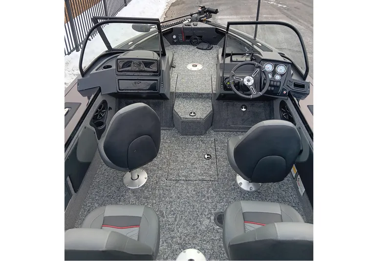 Slide: The Image of Interior view of 2026 Tracker Targa V-19 Combo boat, featuring modern seating and dashboard. - 6