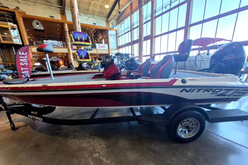The Image of 2026 Nitro Z19 XL boat on display in showroom, featuring sleek design and vibrant colors. - 0