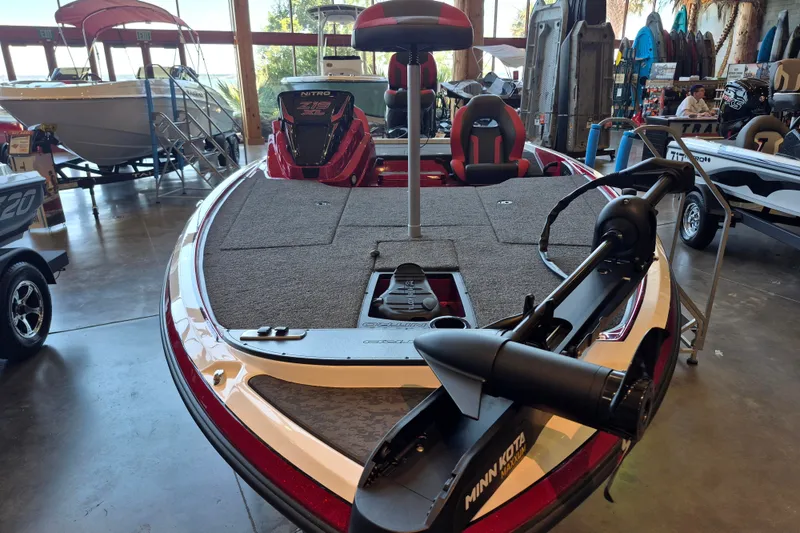 Slide: The Image of 2026 Nitro Z19 XL boat with Minn Kota motor in showroom. - 1
