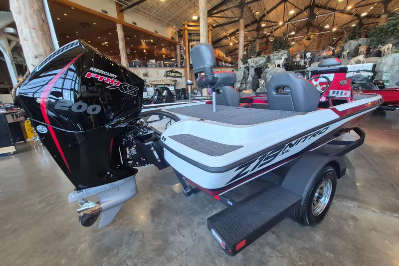 Slide: The Image of 2026 Nitro Z19 XL boat with Mercury Pro XS 200 engine in showroom setting. - 4