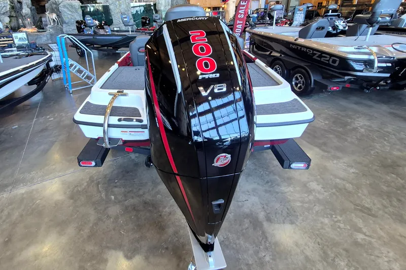 Slide: The Image of 2026 Nitro Z19 XL boat with Mercury 200 Pro XS V8 engine displayed indoors. - 5