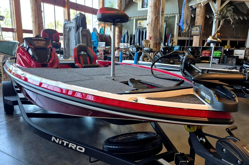 Slide: The Image of 2026 Nitro Z19 XL bass boat displayed in showroom, featuring sleek design and advanced equipment. - 2