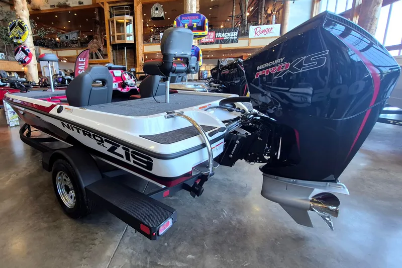 Slide: The Image of 2026 Nitro Z19 XL boat with Mercury Pro XS engine displayed indoors. - 6