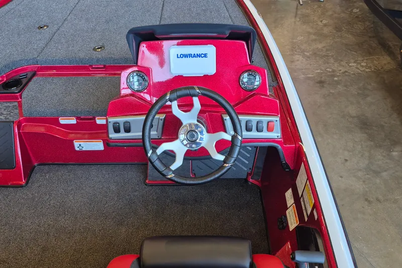 Slide: The Image of Interior view of a 2026 Nitro Z19 XL boat dashboard with steering wheel and controls. - 8