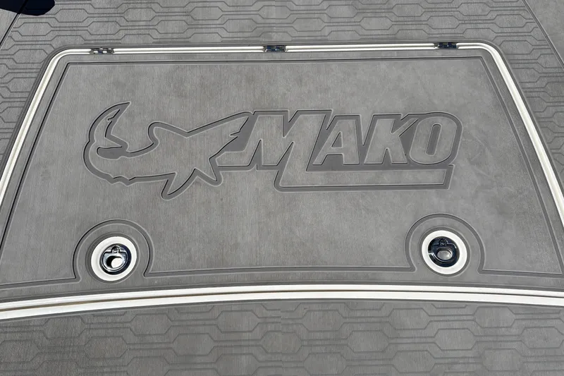 Slide: The Image of Deck of 2026 Mako 18 Pro Skiff with logo and textured surface. - 32