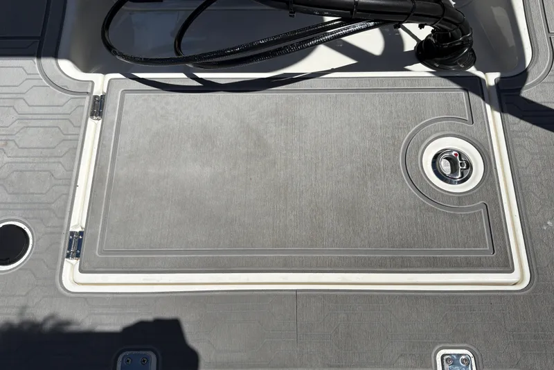 Slide: The Image of 2026 Mako 18 Pro Skiff deck hatch with sleek design and secure latch. - 29