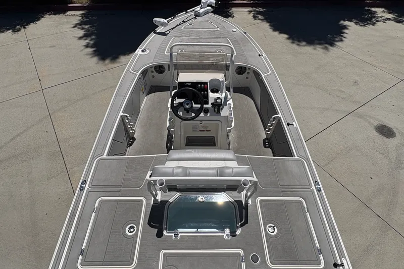 Slide: The Image of 2026 Mako 18 Pro Skiff boat interior with steering console and seating. - 15