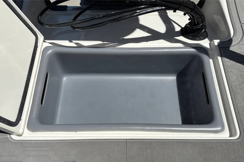 Slide: The Image of Open storage compartment on 2026 Mako 18 Pro Skiff boat, featuring a spacious interior. - 24