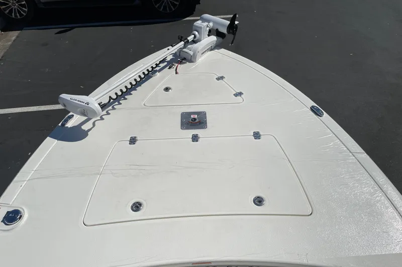 Slide: The Image of Bow view of 2026 Mako 18 Pro Skiff with trolling motor on deck. - 6