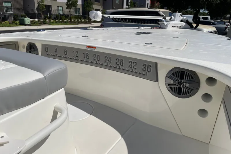 Slide: The Image of 2026 Mako 18 Pro Skiff boat interior with measurement scale and speaker detail. - 16