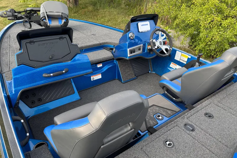 Slide: The Image of 2026 Nitro Z19 XL boat interior with blue accents and modern steering console. - 5