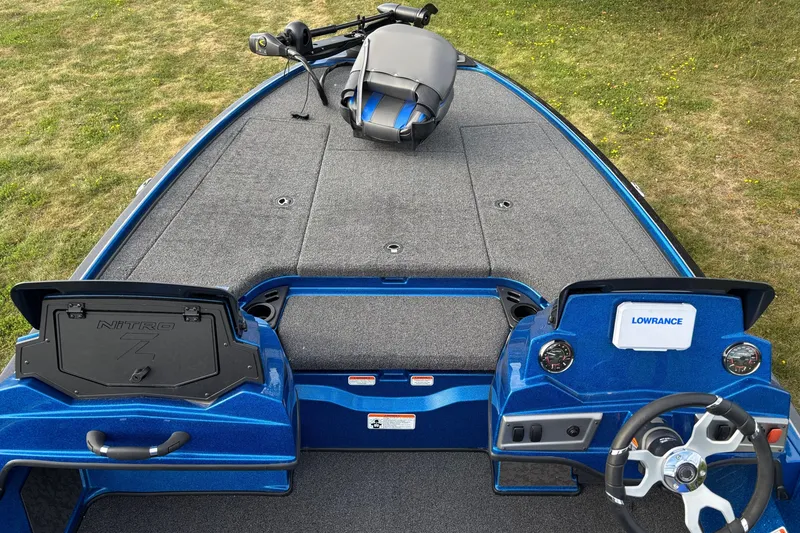Slide: The Image of 2026 Nitro Z19 XL boat interior with Lowrance electronics, blue finish, and spacious deck. - 3