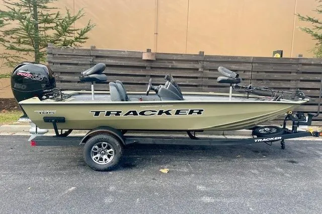 The Image of 2026 Tracker Pro Team 195 boat on trailer, parked outdoors. - 0