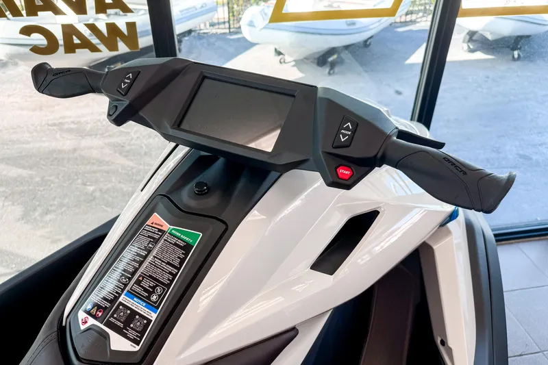 Slide: The Image of 2025 Taiga Orca P2 jet ski dashboard with digital display and control buttons. - 3