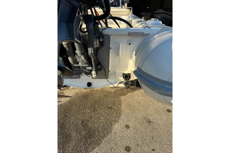 Slide: The Image of 2022 AB Inflatables Alumina 11 ALX boat engine and hull detail in sunlight. - 7