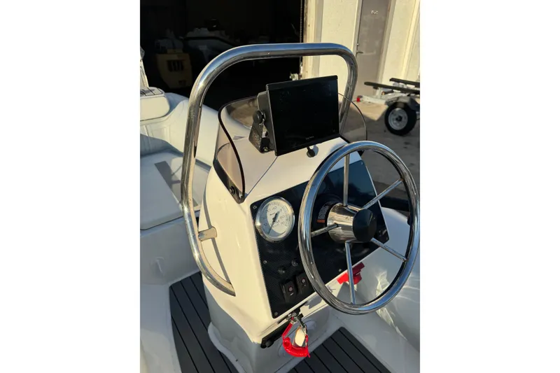 Slide: The Image of 2022 AB Inflatables Alumina 11 ALX boat steering console with stainless steel wheel. - 9