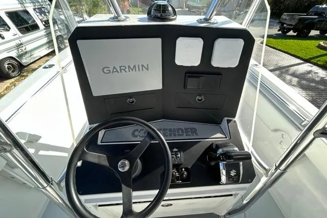 Slide: The Image of 2006 Contender 21 Open boat dashboard with Garmin navigation system. - 10