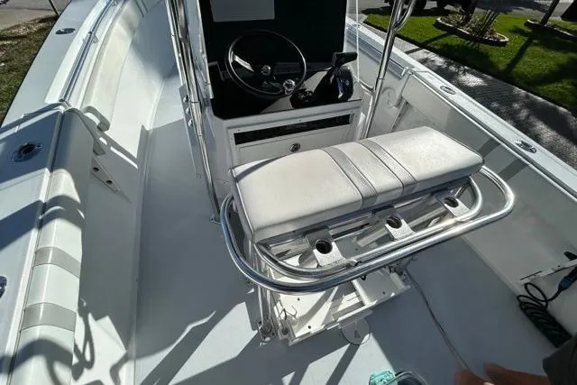 Slide: The Image of 2006 Contender 21 Open boat interior with steering console and cushioned seating. - 11