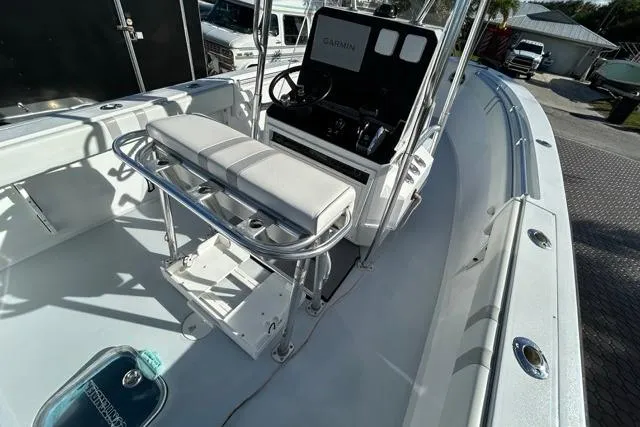 Slide: The Image of 2006 Contender 21 Open boat interior with seating and Garmin navigation system. - 21