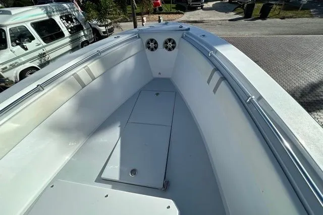 Slide: The Image of 2006 Contender 21 Open boat interior with spacious deck and storage compartments. - 3