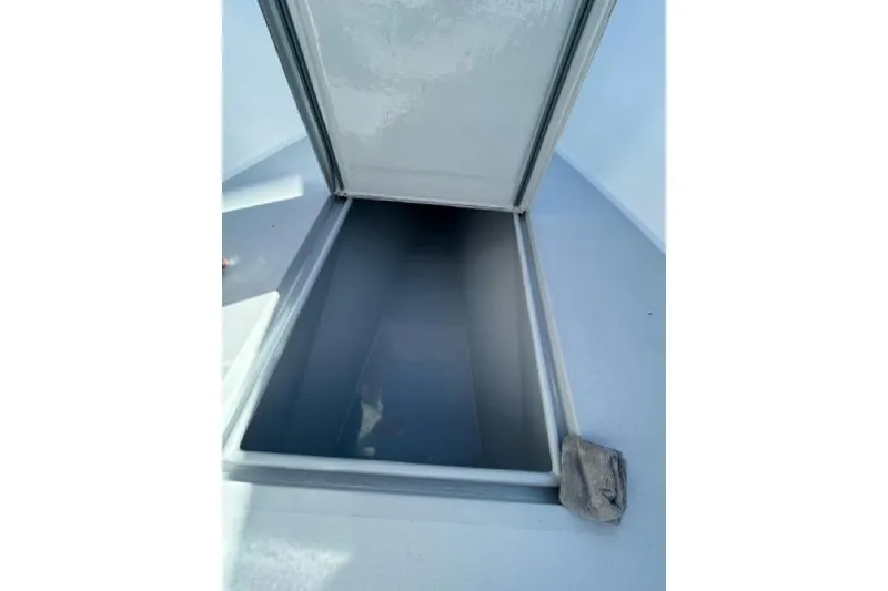 Slide: The Image of Open storage compartment on a 2006 Contender 21 Open boat. - 4