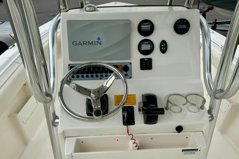 Slide: The Image of 2019 Key West 239 FS boat console with Garmin display and Yamaha controls. - 17