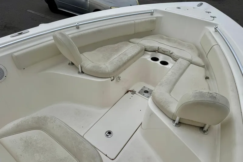 Slide: The Image of 2019 Key West 239 FS boat interior with cushioned seating and speaker. - 21