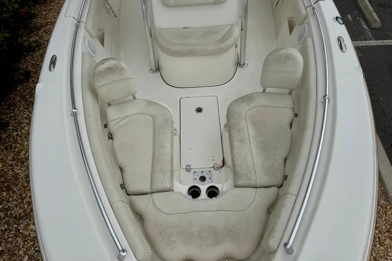 Slide: The Image of 2019 Key West 239 FS boat interior with cushioned seating and Yamaha engine. - 22
