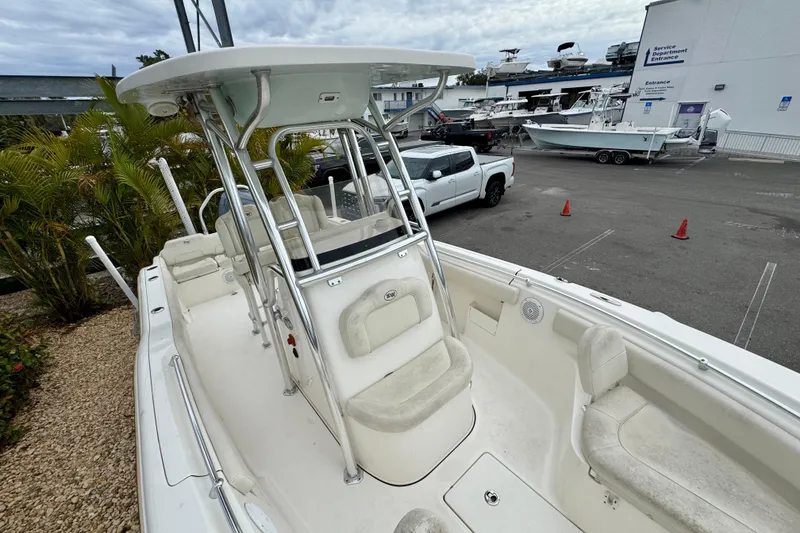 Slide: The Image of 2019 Key West 239 FS boat interior with steering wheel and Garmin navigation system. - 25