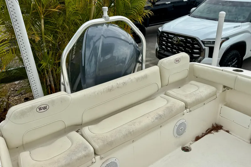 Slide: The Image of 2019 Key West 239 FS boat interior with cushioned seating and stainless steel railings. - 29