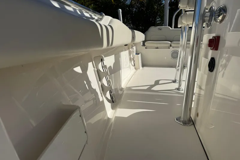 Slide: The Image of 2019 Key West 239 FS boat interior with seating and rod holders. - 31
