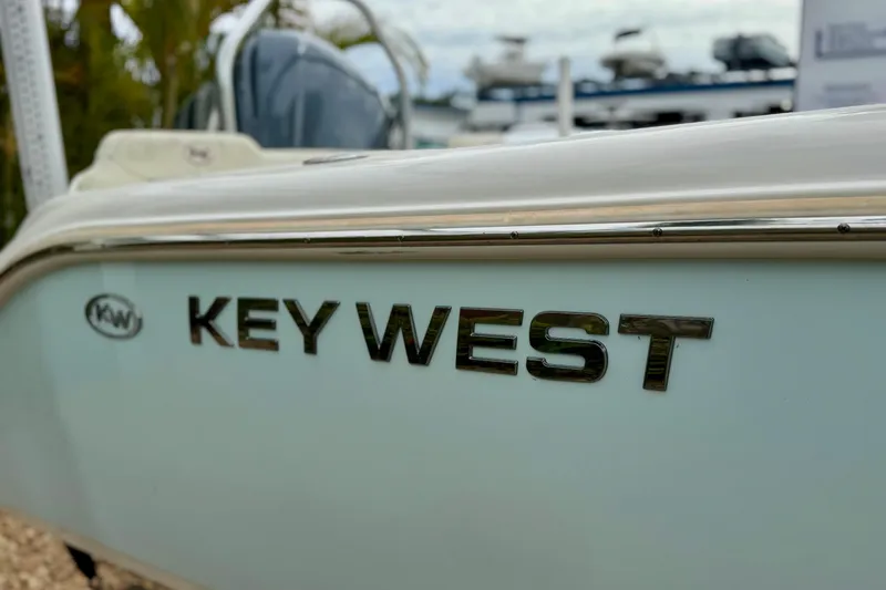 Slide: The Image of 2019 Key West 239 FS boat side view with logo. - 6