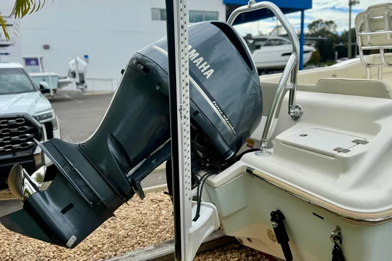 Slide: The Image of 2019 Key West 239 FS boat with Yamaha outboard motor in a marina setting. - 8
