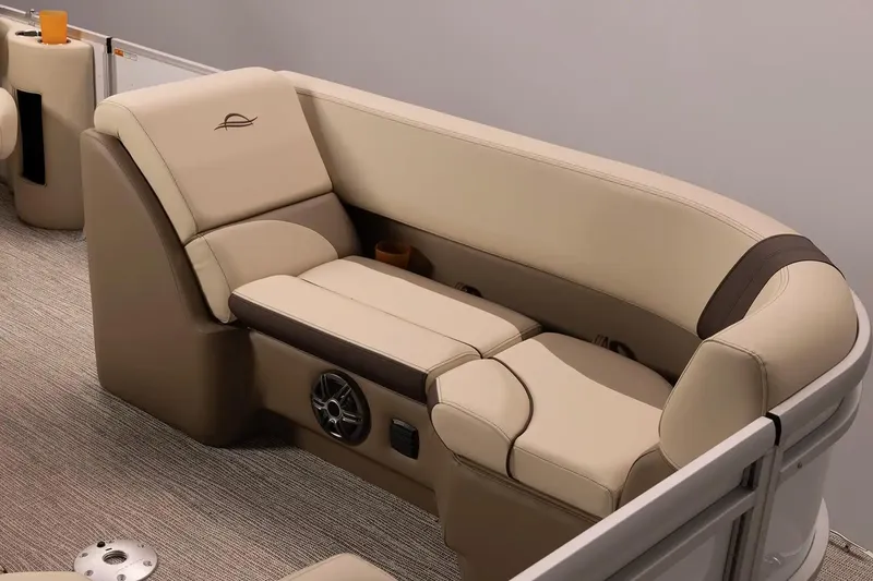 Slide: The Image of Luxurious seating on 2026 SunCatcher Elite 322 SR pontoon boat, featuring beige upholstery. - 3