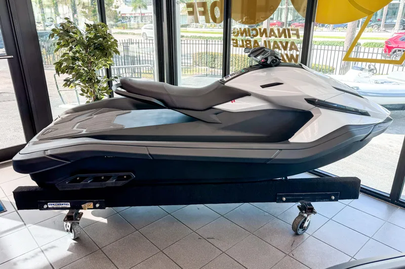 The Image of 2025 Taiga Orca P2 jet ski displayed indoors on a wheeled stand. - 0