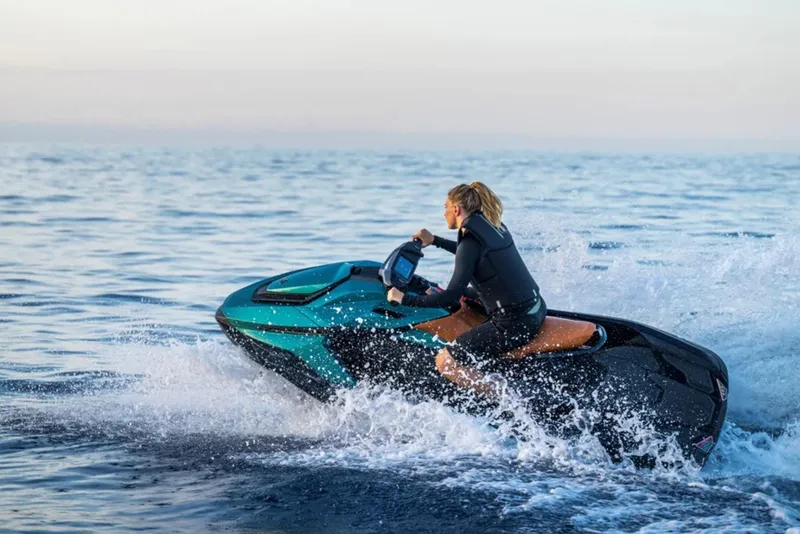 Slide: The Image of Woman riding 2025 Taiga Orca P2 jet ski on the sea. - 11