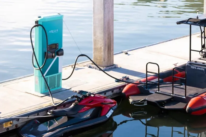Slide: The Image of Electric watercraft charging at dock, featuring 2025 Taiga Orca P2 model. - 14