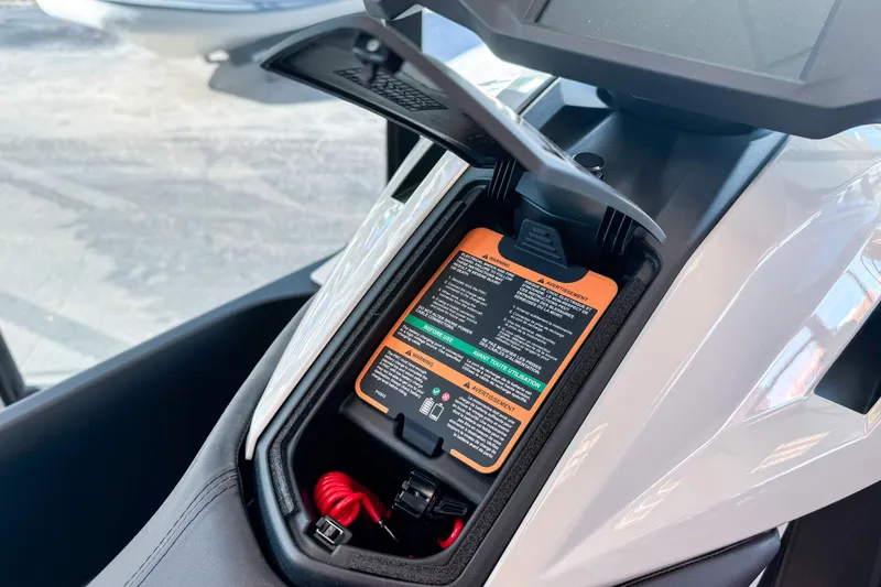 Slide: The Image of 2025 Taiga Orca P2 storage compartment with visible safety instructions and red cable. - 4