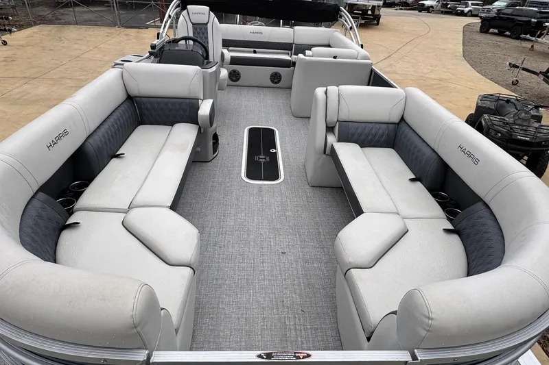 Slide: The Image of 2025 Harris Sunliner 230 pontoon boat interior with spacious seating and modern design. - 3