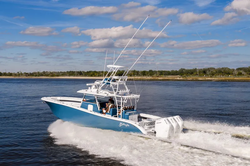 Slide: The Image of 2024 Yellowfin 42 Offshore boat cruising on a sunny day with blue skies. - 10