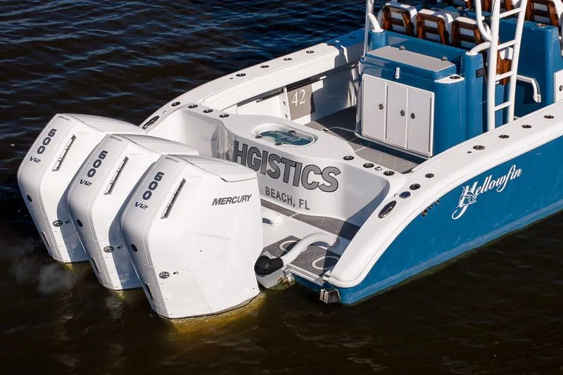 Slide: The Image of 2024 Yellowfin 42 Offshore boat with triple Mercury 600 V12 engines on water. - 15