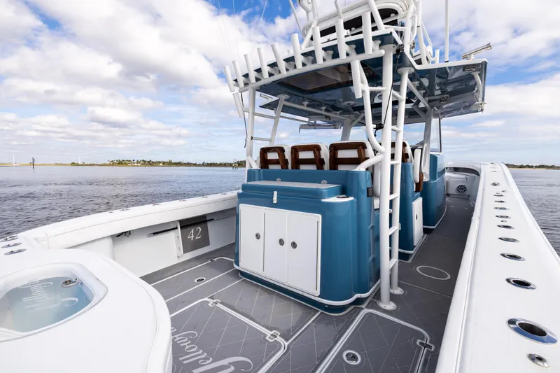 Slide: The Image of 2024 Yellowfin 42 Offshore boat with sleek design on calm waters. - 20