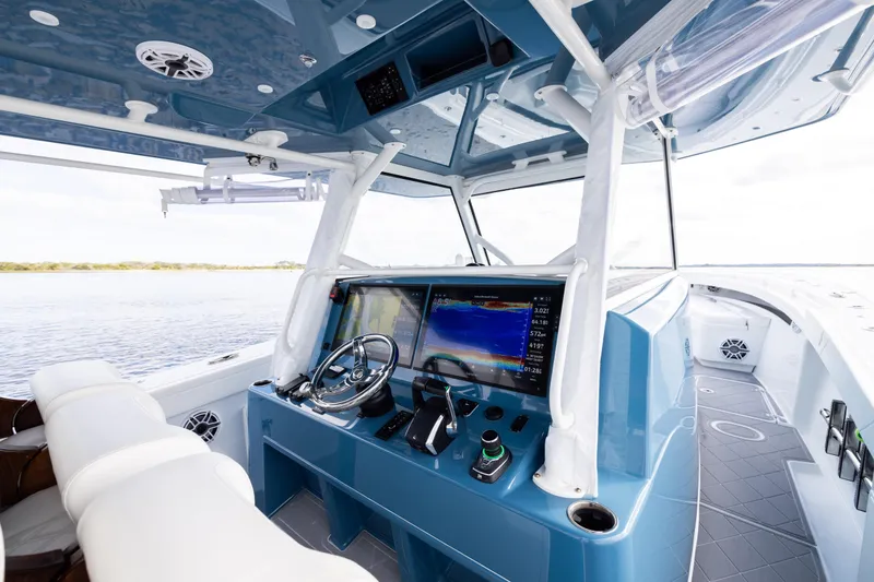 Slide: The Image of 2024 Yellowfin 42 Offshore boat cockpit with advanced navigation system and luxurious seating. - 29