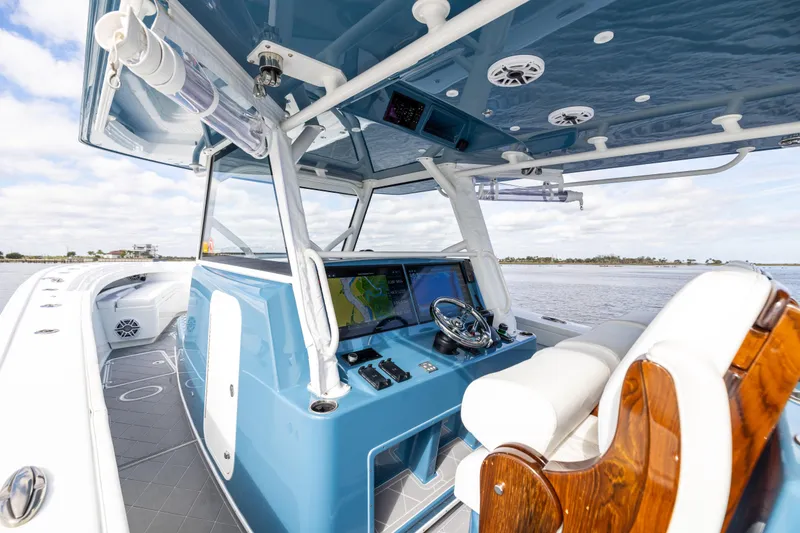Slide: The Image of 2024 Yellowfin 42 Offshore boat interior with modern helm and navigation system. - 31