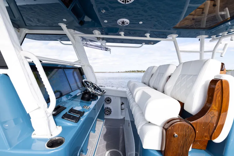 Slide: The Image of 2024 Yellowfin 42 Offshore boat interior with modern helm and luxurious seating. - 41