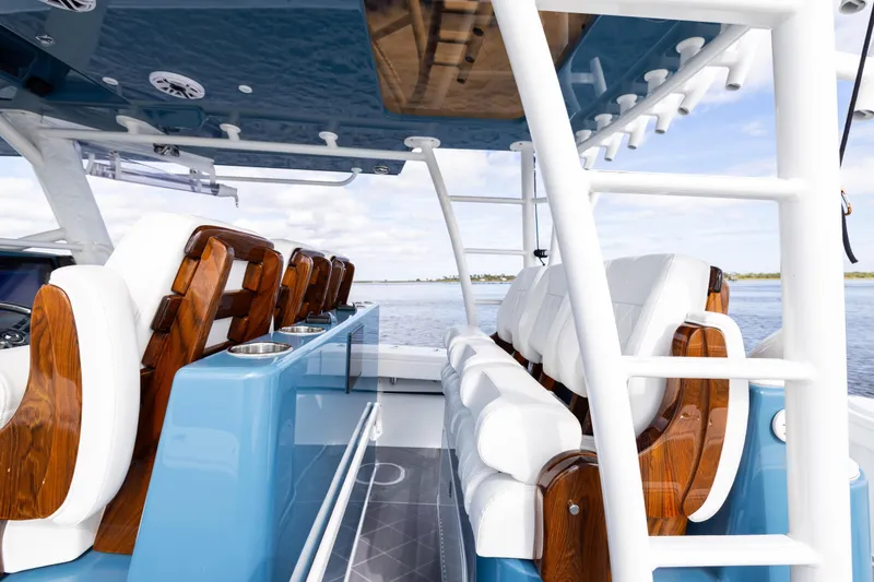Slide: The Image of 2024 Yellowfin 42 Offshore boat interior with luxurious seating and ocean view. - 42