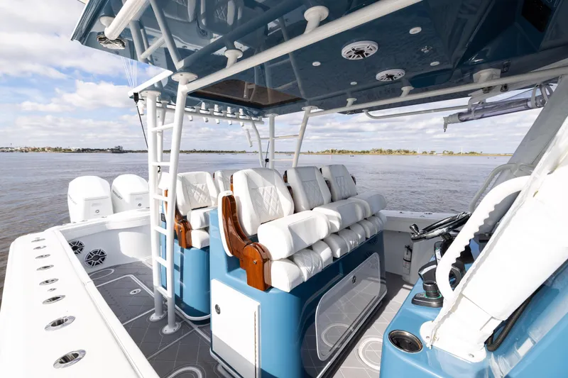 Slide: The Image of 2024 Yellowfin 42 Offshore boat interior with luxurious seating and modern design on open water. - 43
