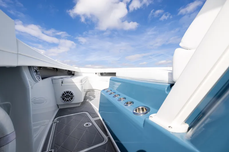 Slide: The Image of 2024 Yellowfin 42 Offshore boat interior with blue accents and modern design. - 52