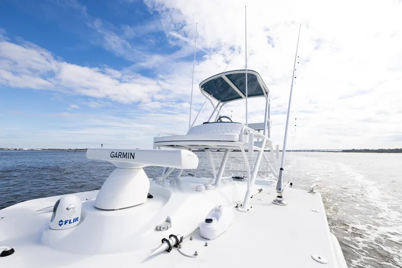 Slide: The Image of 2024 Yellowfin 42 Offshore boat with Garmin and FLIR equipment on open water. - 53
